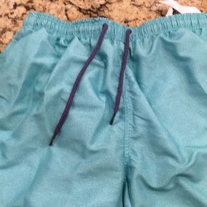 Spicy Tuna XL men’s swim trunks. Turquoise.